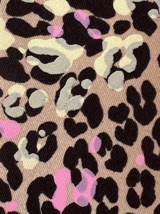 detail of leopard print cotton twill with pink and yellow accents