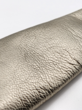 Close-up of texture of gold metallic leather