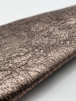 Close-up of distressed metallic leather