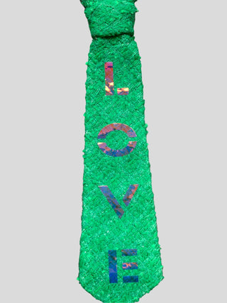 Closeup of Kelly green petite tie with the word Love hand painted