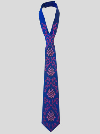 Flat image of royal blue necktie with baroque inspired purple embroidery and crystal beading