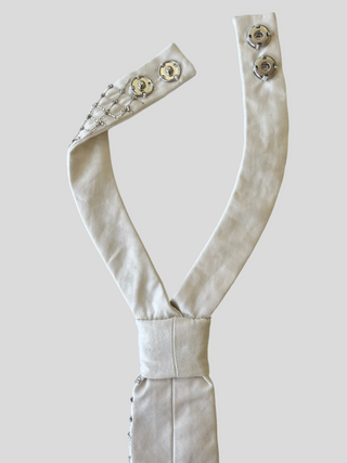 Back view of adjustable snap closure on embroidered crosshatch petite