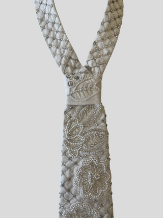 Closeup of embellishments on embroidered crosshatch petite