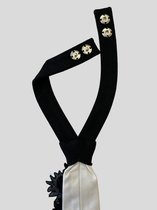 Back view of petite floral tie showing adjustable silver snaps on black neckband.