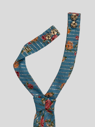 Back view of silver adjustable snaps on blue necktie with pink roses and lurex stripes.