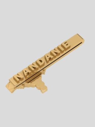 Back view of gold elephant tie bar with brand name
