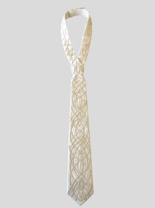 Flat image of ivory classic tie with geometric pearl all-over embroidery