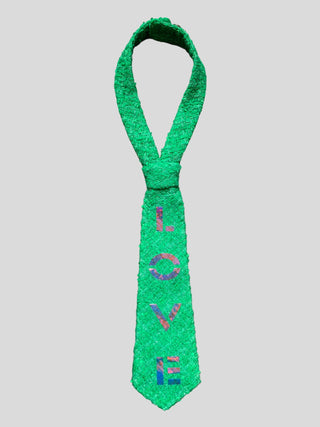 Flat image of Kelly green petite tie with the word Love hand painted in iridescent letters 